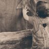 A boy leaning on the Wall